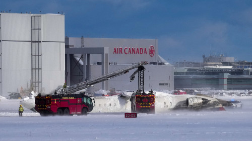 Delta plane flips on landing at Toronto airport, injuring 8